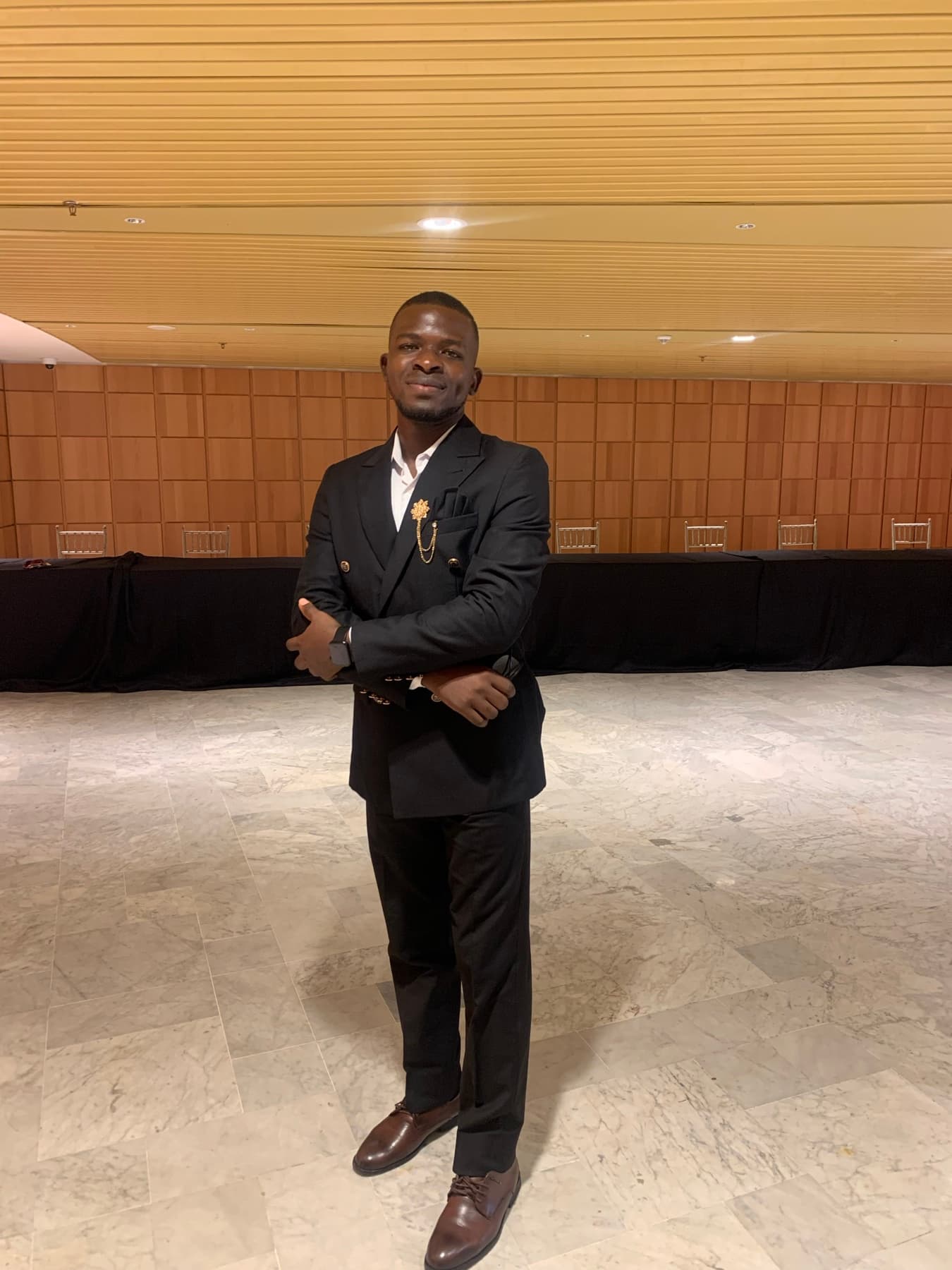 Israel Afolabi at a technology conference venue